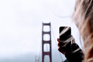 iPhone photographing the Golden Gate Bridge; California iPhone buyers can claim in the Apple Siri settlement