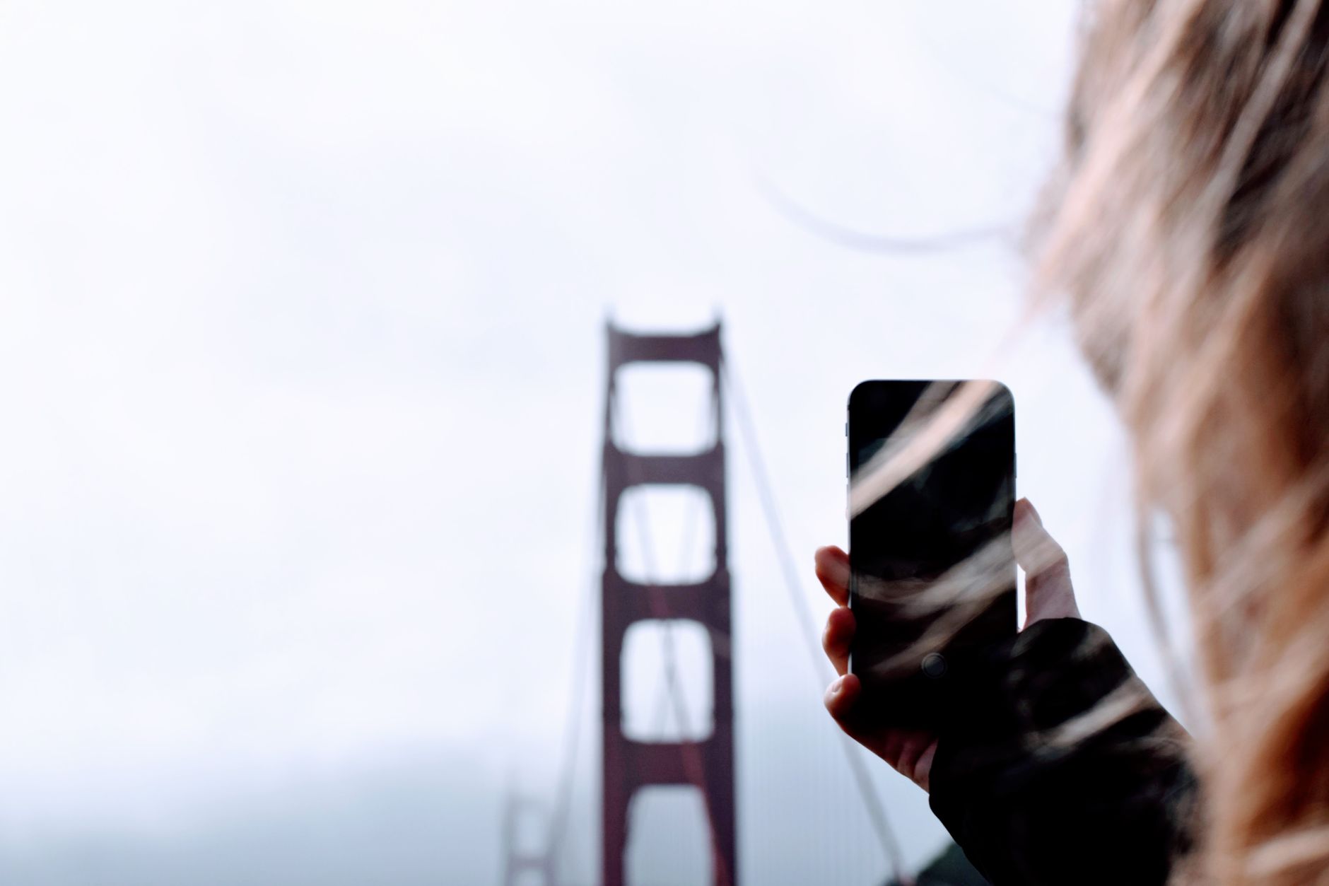 iPhone photographing the Golden Gate Bridge; California iPhone buyers can claim in the Apple Siri settlement
